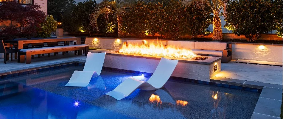 Fire pit near a swimming pool in Durham County, NC.