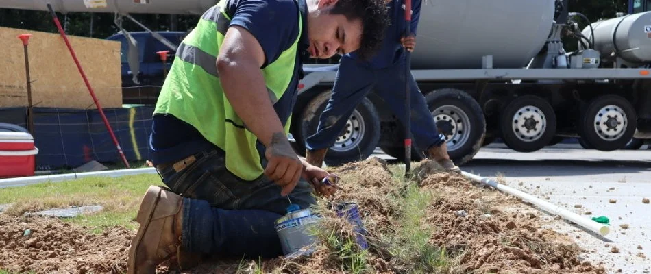 Workers installing a new irrigation system in Cary, NC.